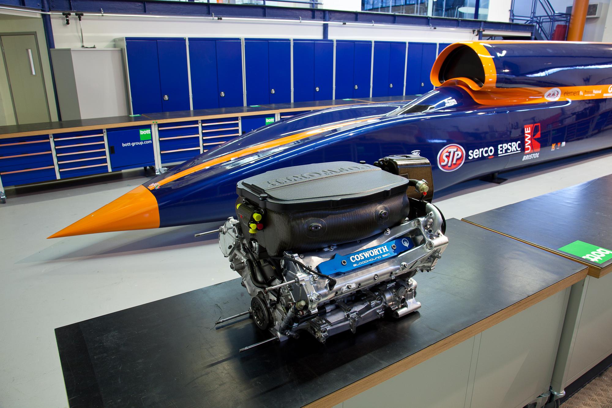 The Cosworth CA2010 F1 race engine alongside the full size BLOODHOUND SSC Show Car. Photograph by Flow Images